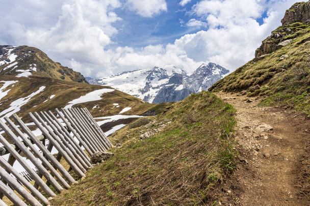 Mountain trail near Passo Pordoi with a view of the Marmolada ma - Photo, Image