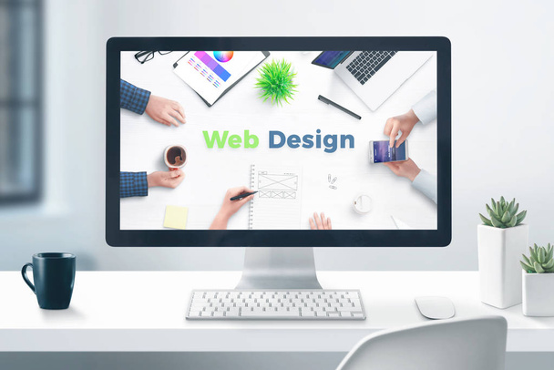Web design studio concept. Desktop computer display on flat office desk. Close-up. - Photo, Image