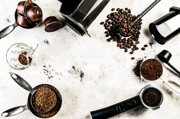 Coffee concept - beans, ground, instant, capsules, marble background - Foto, imagen