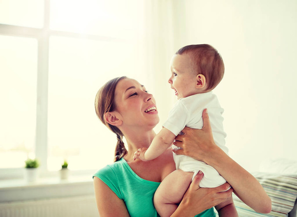 happy young mother with little baby at home - Foto, Imagem
