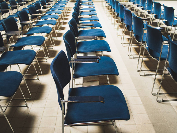 lecture hall empty with blue chairs - 写真・画像