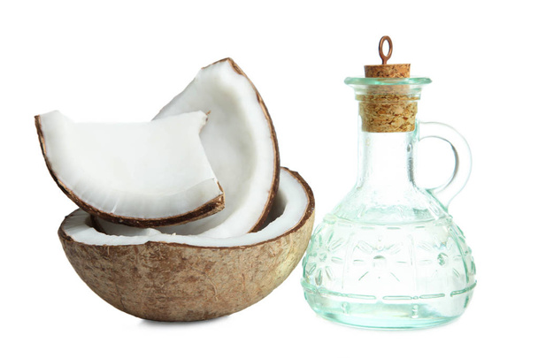 coconut and bottle with coconut oil - Photo, Image