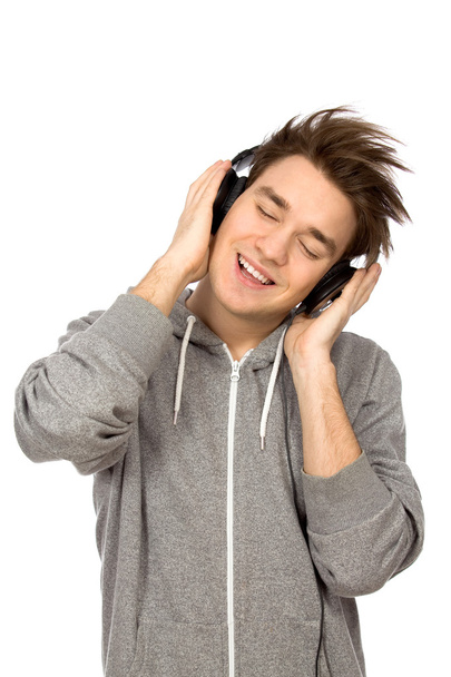 Young man wearing headphones - Фото, изображение