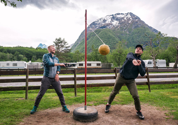 two friends are playing tetherball game - Foto, Imagen