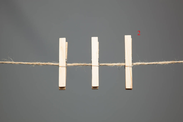 Halat clothespins ile, clothespins ahşap ve sembollerden yapılmış. - Fotoğraf, Görsel