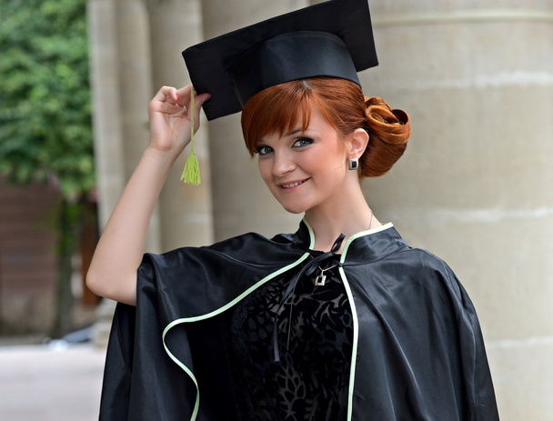 A university graduate in robes - 写真・画像