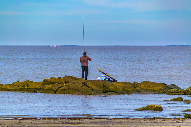 People Fishing at Breakwater, Montevideo, Uruguay - Foto, imagen
