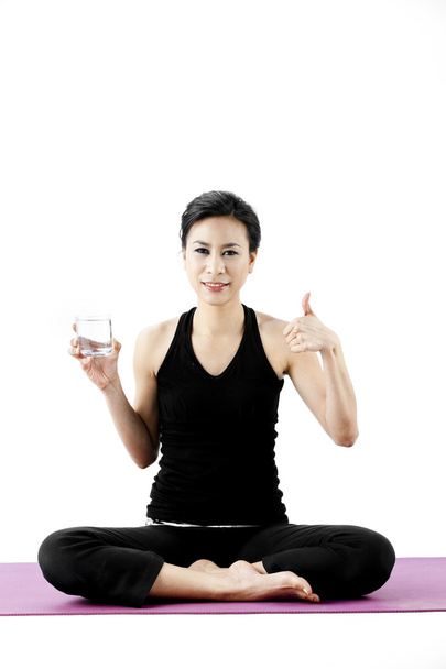 Sports woman drinks water - Foto, Imagen