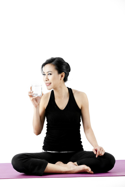 Sports woman drinks water - Fotó, kép