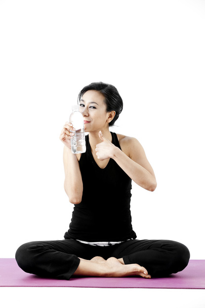 Sports woman drinks water - Foto, imagen