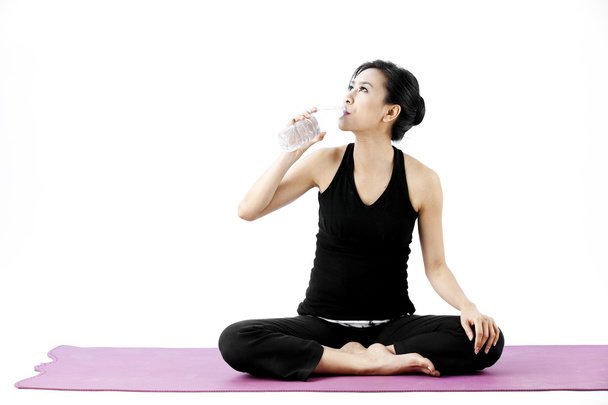 Sports woman drinks water - Photo, image