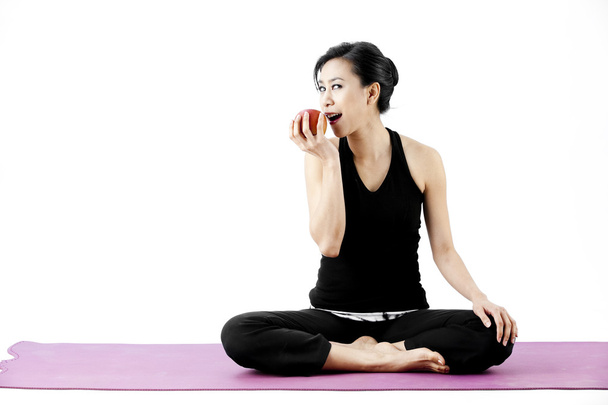 Asian woman eat apple - 写真・画像