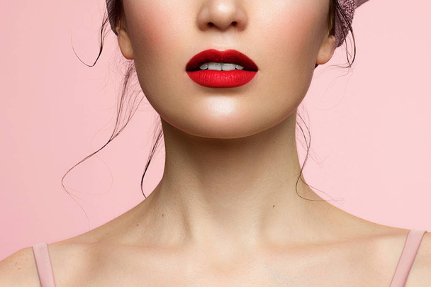 Close-up of woman's lips with fashion red lipstick makeup. Macro sexy pale lipgloss make-up . Gentle pure skin and underwear. Cosmetology, Spa, increase in full lips - Фото, зображення