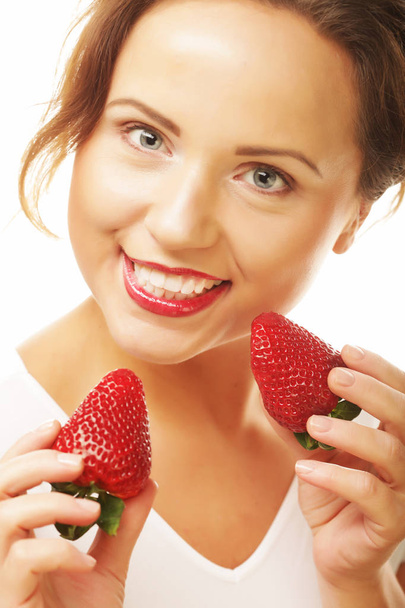 Healthy eating, food and diet concept - Young beautiful happy smiling woman with strawberry - Photo, image