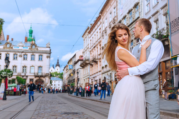 Profile of newlyweds is hugging each other on the background of  - Photo, Image