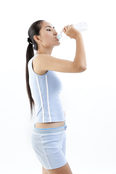 Sporty woman drinking water, isolated against white background - Foto, Imagem