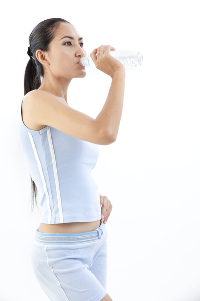 Sporty woman drinking water, isolated against white background - Foto, Imagem
