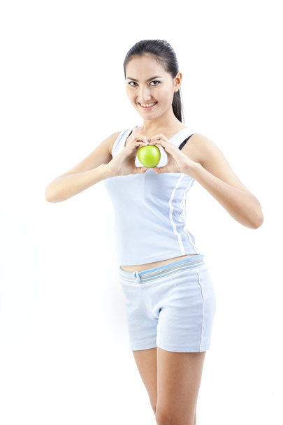 Beautiful asian woman holding green apple on white - Valokuva, kuva