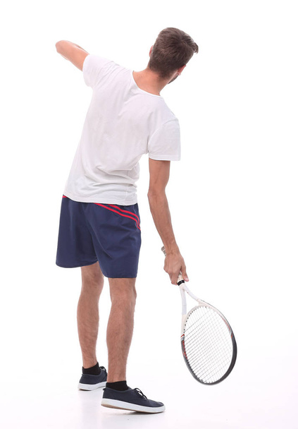 rear view. a young man with a tennis racket. - Photo, image