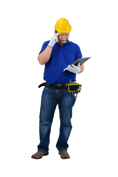 Foreman budowlany w niebieskiej koszulce z rękawicami ochronnymi, Helme - Zdjęcie, obraz
