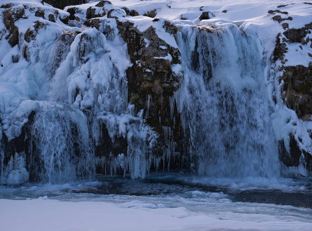 The Kirkjufellsfoss waterfall in Iceland in the evening - Φωτογραφία, εικόνα