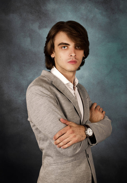 Portrait of young  handsome man posing in studio - Photo, Image