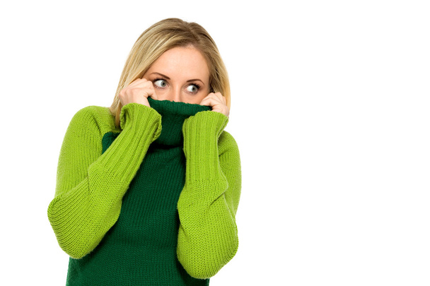Woman pulling sweater over face - Photo, Image