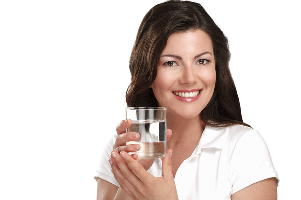 young beautiful woman drinking a glass of water - Photo, Image
