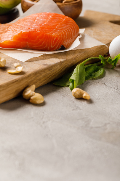 fresh raw salmon on wooden chopping board, ketogenic diet menu - Photo, Image