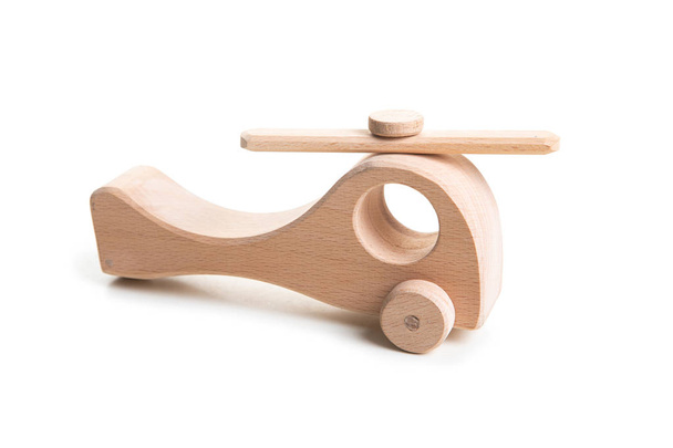 Wooden helicopter toy on white background. - Foto, immagini