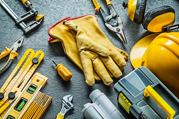 big set of construction tools with gloves in centre on black bac - Φωτογραφία, εικόνα