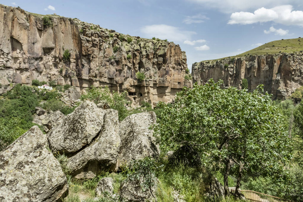 Ihlara,Aksaray,Turkey-May 30,2019.Ihlara Valley (Peristrema Monastery) or Ihlara Gorge is the most famous valley in Turkey for hiking excursions. Green nature view from Ihlara valley - Photo, Image