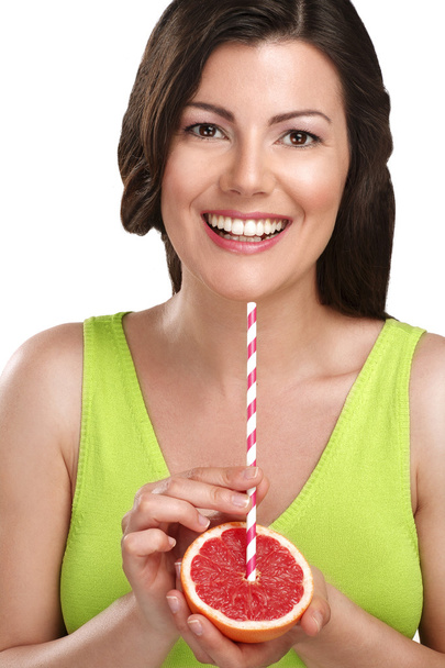 Top up on vitamin c for beautiful young woman drinking juice dir - Foto, imagen
