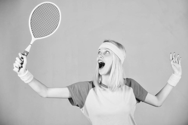 Sport for maintaining health. Woman hold tennis racket in hand. Tennis club concept. Tennis sport and entertainment. Active leisure and hobby. Girl fit slim blonde play tennis. Active lifestyle - Фото, изображение