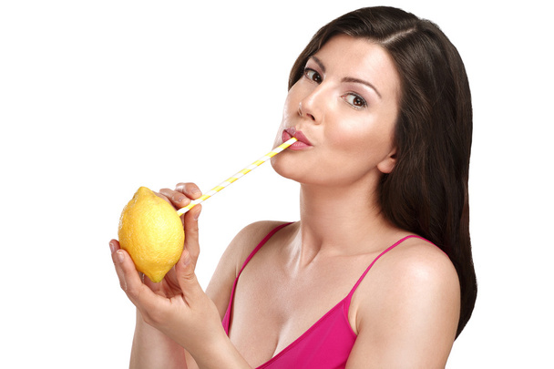 Top up on vitamin c for beautiful young woman drinking juice dir - Foto, afbeelding