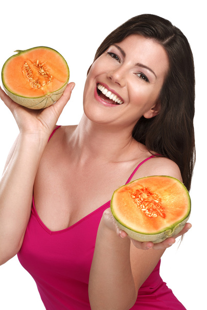 young beautiful woman showing fresh fruits of season - Photo, image