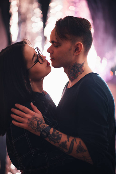 guy and the girl kiss closeup on a light background. - Fotó, kép