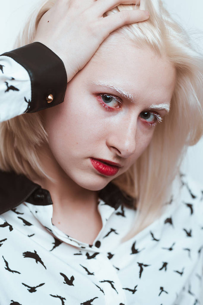 portrait blonde albino girl in studio on white background - 写真・画像