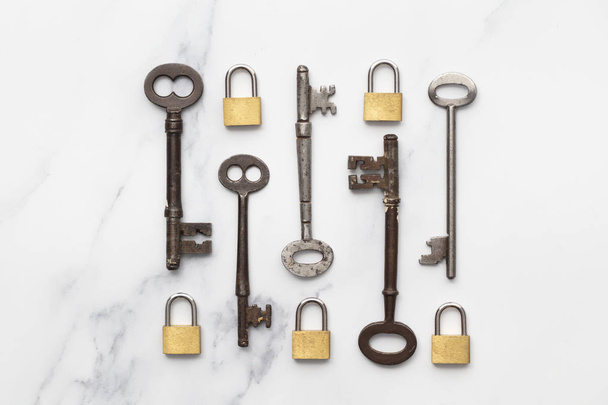 Vintage keys and padlocks overhead lay flat composition. Security concept - Φωτογραφία, εικόνα