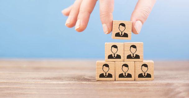 human resources concept, wooden cubes represent stacked personne - Photo, Image