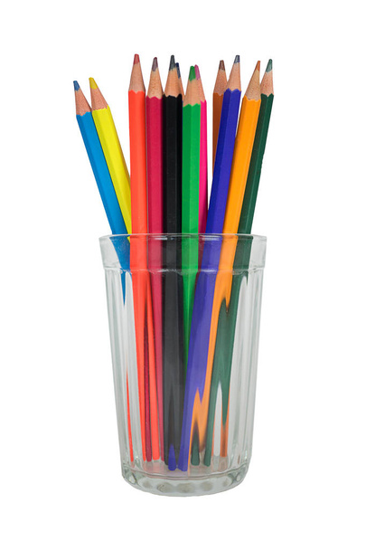group of Multi-colored pencils in a transparent glass mug isolated on white - Fotó, kép