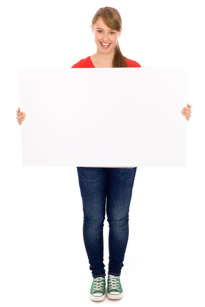 Beautiful young woman holding placard - 写真・画像
