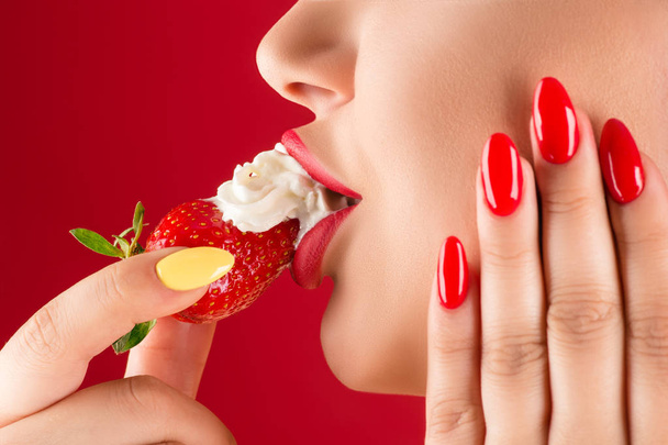 sensual lips with strawberries and cream close-up  - Photo, Image