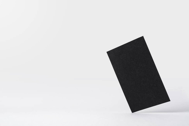 Black business card isolated on white background for mockup - Zdjęcie, obraz