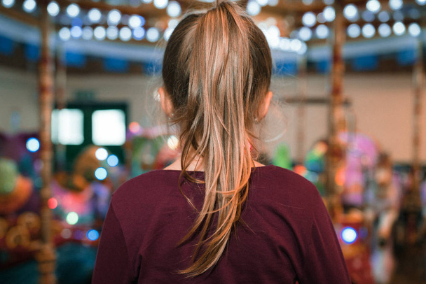 Girl with a ponytail in an  indoor amusement playground - Photo, Image