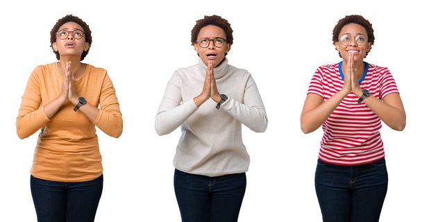 Jovem afro-americana com cabelo afro vestindo óculos implorando e orando com as mãos junto com a expressão da esperança no rosto muito emocional e preocupado. A pedir perdão. Conceito de religião
. - Foto, Imagem