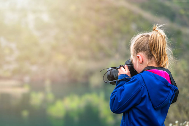 Little girl photographing nature - Фото, изображение
