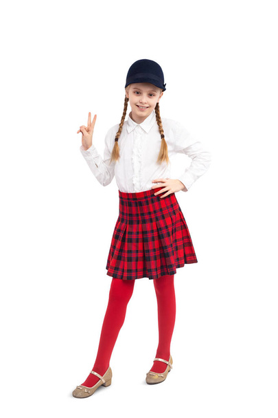 Confident schoolgirl gesturing V sign - Foto, Imagen