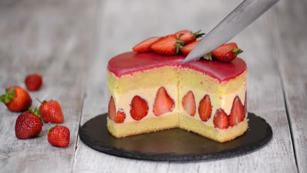 Strawberry cake. Fraisier cake on wooden background. - Footage, Video