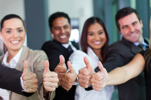 Business group giving thumbs up - Foto, Imagem
